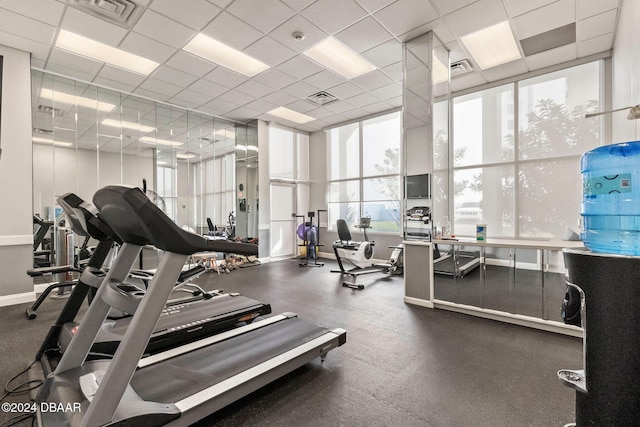 exercise room with a drop ceiling