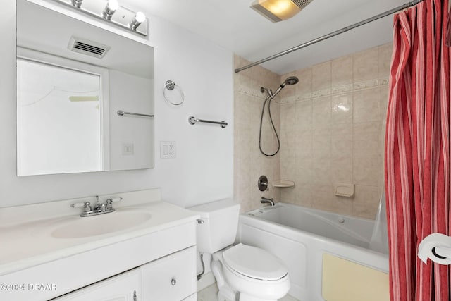 full bathroom featuring shower / bath combo, vanity, and toilet