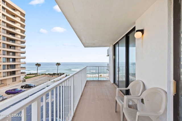 balcony featuring a water view