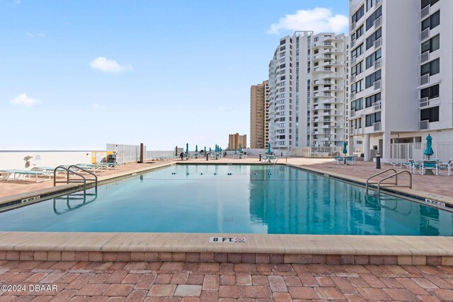 view of pool featuring a patio