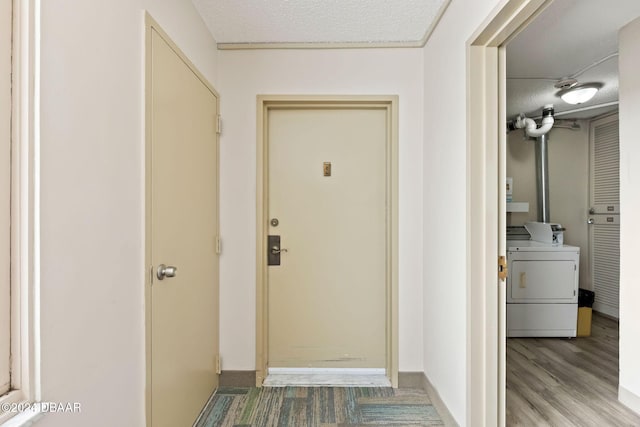 entrance to property featuring washer and dryer