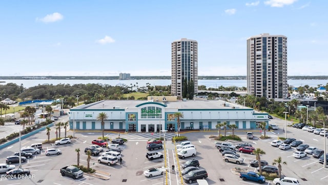 birds eye view of property with a water view