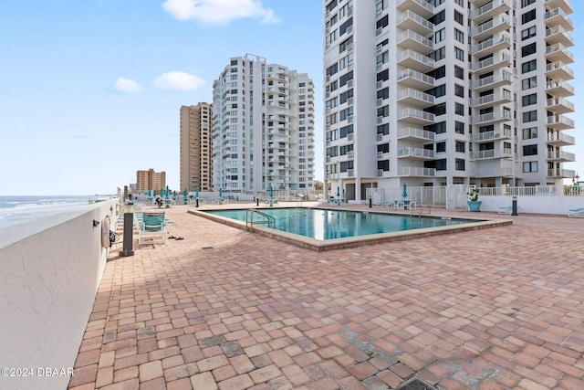 view of pool featuring a patio area