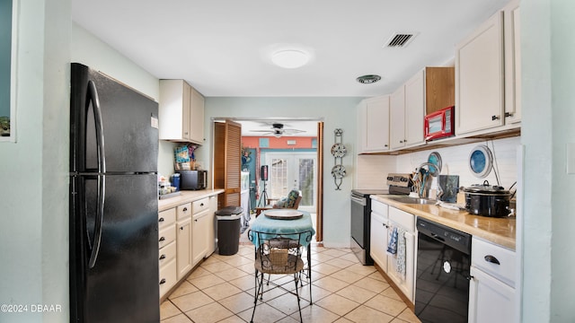 kitchen with white cabinets, black appliances, light tile patterned flooring, and ceiling fan