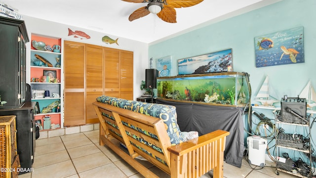 tiled living room featuring ceiling fan