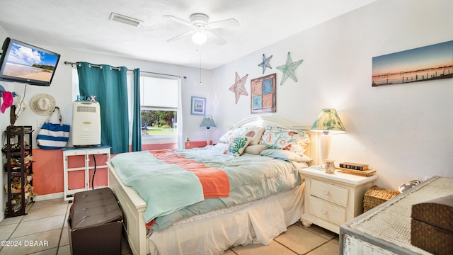 tiled bedroom with ceiling fan