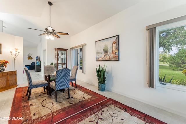 414 Long Cove Ct, Ormond Beach, FL 32174 - dining area featuring light tile patterned floors, lofted ceiling, and a ceiling fan