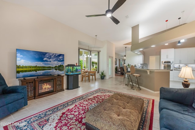 414 Long Cove Ct, Ormond Beach, FL 32174 - living area with ceiling fan, light tile patterned flooring, and high vaulted ceiling