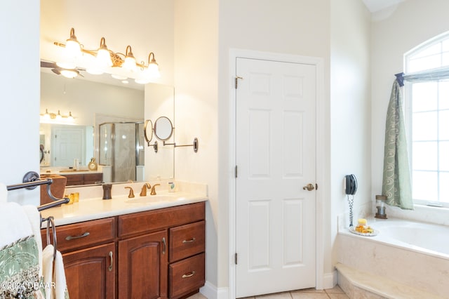 bathroom with vanity, plus walk in shower, and tile patterned flooring