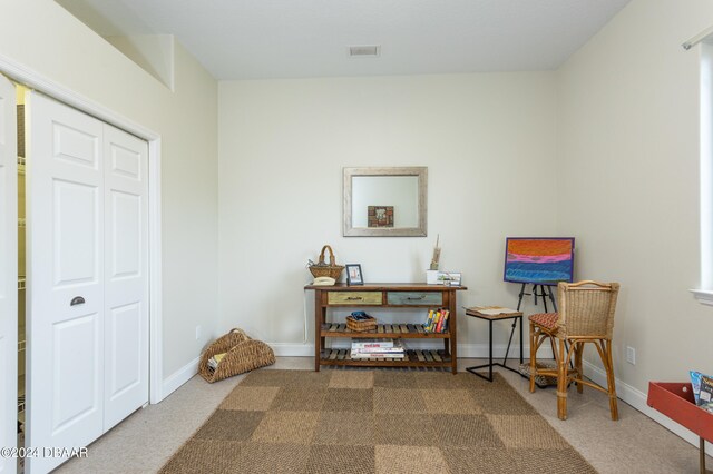 sitting room featuring carpet floors