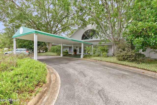 view of parking with a carport