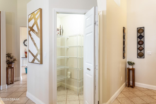 hallway featuring light tile patterned floors