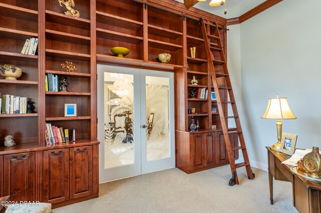 interior space with light colored carpet, french doors, and ornamental molding