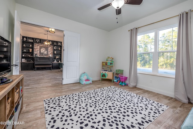 playroom featuring ceiling fan and hardwood / wood-style flooring