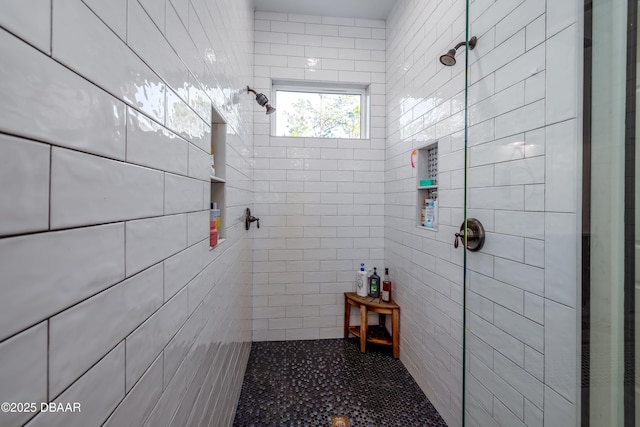 bathroom with a tile shower