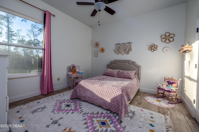 bedroom with light wood-type flooring and ceiling fan