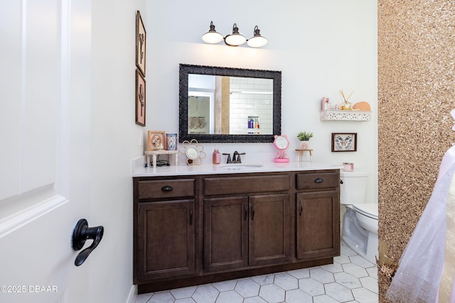 bathroom with toilet and vanity