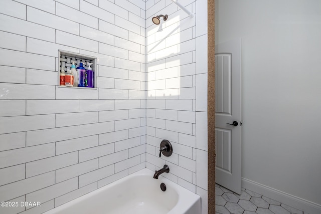 bathroom with tile patterned floors and tiled shower / bath combo