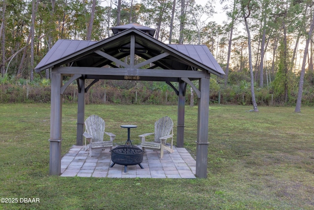 view of patio with an outdoor fire pit and a gazebo