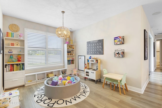 1602 Killian Drive Ne, Palm Bay, FL 32905 - recreation room featuring light wood-type flooring and a chandelier