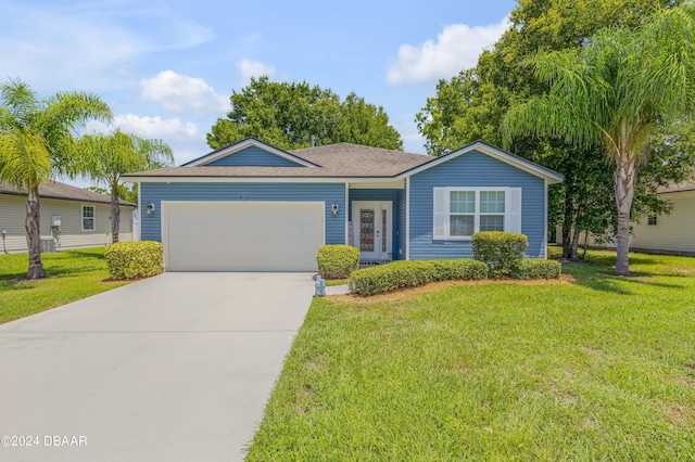 ranch-style home with a garage and a front yard