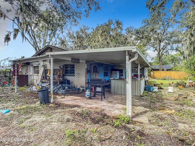 rear view of house with a patio