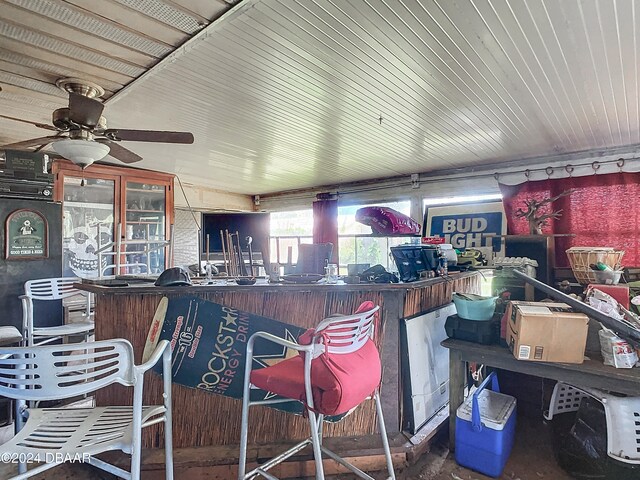 view of patio featuring ceiling fan and an outdoor bar