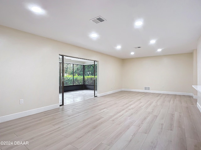 spare room featuring light hardwood / wood-style floors