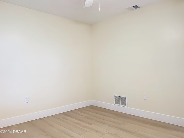 spare room featuring light wood-type flooring