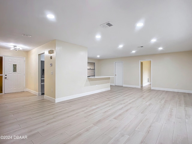 unfurnished living room featuring light wood-type flooring