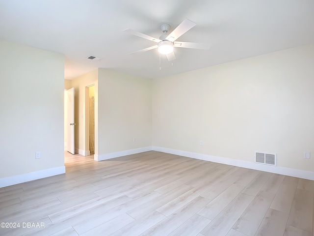 unfurnished room with ceiling fan and light hardwood / wood-style floors