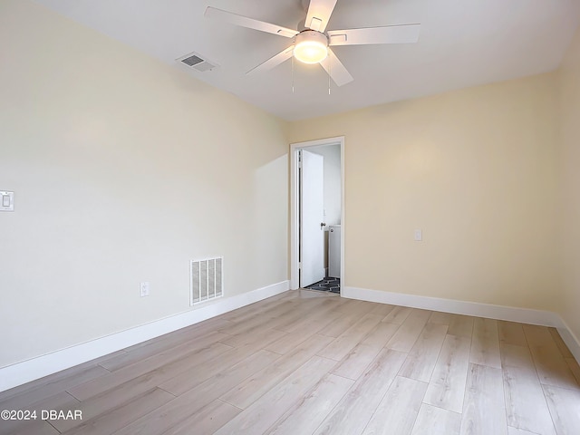 spare room featuring light hardwood / wood-style floors and ceiling fan