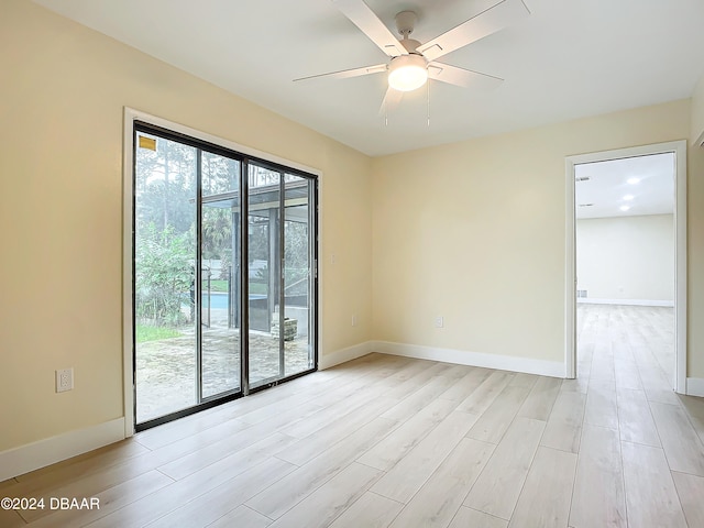 unfurnished room with ceiling fan and light hardwood / wood-style floors