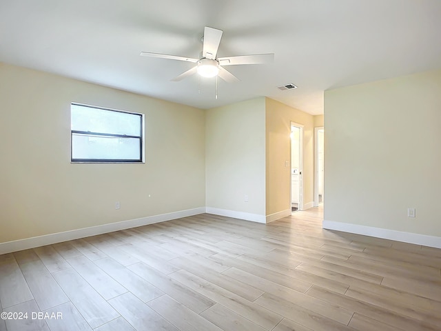 spare room featuring ceiling fan and light wood-type flooring