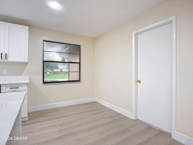 unfurnished dining area with light hardwood / wood-style flooring