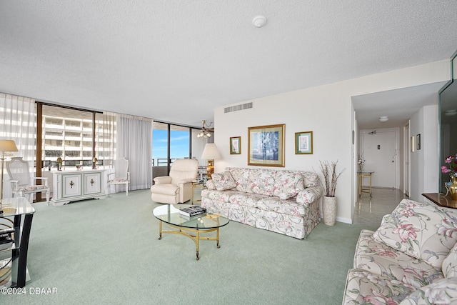 2828 N Atlantic Ave Unit 1205, Daytona Beach, FL 32118 - carpeted living area featuring a textured ceiling