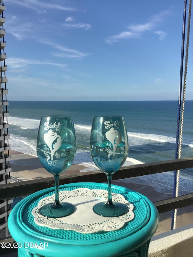 balcony featuring a water view