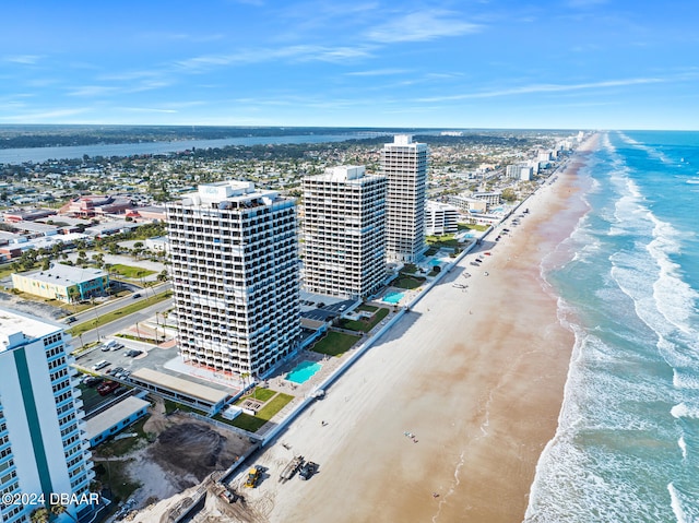 birds eye view of property featuring a view of the beach and a water view