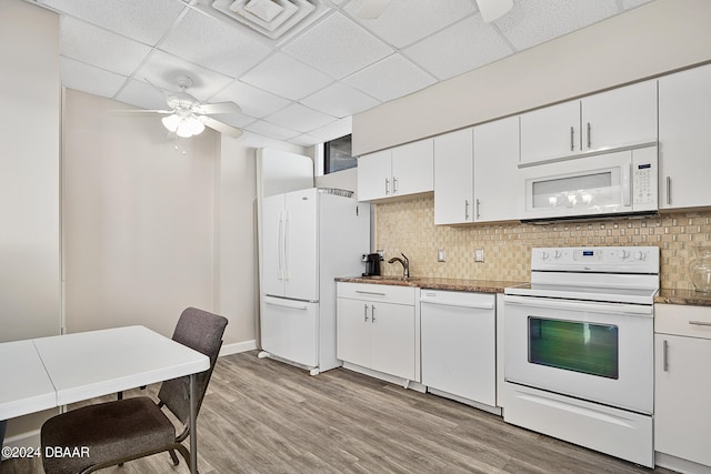 kitchen with a paneled ceiling, ceiling fan, white cabinetry, light hardwood / wood-style flooring, and white appliances