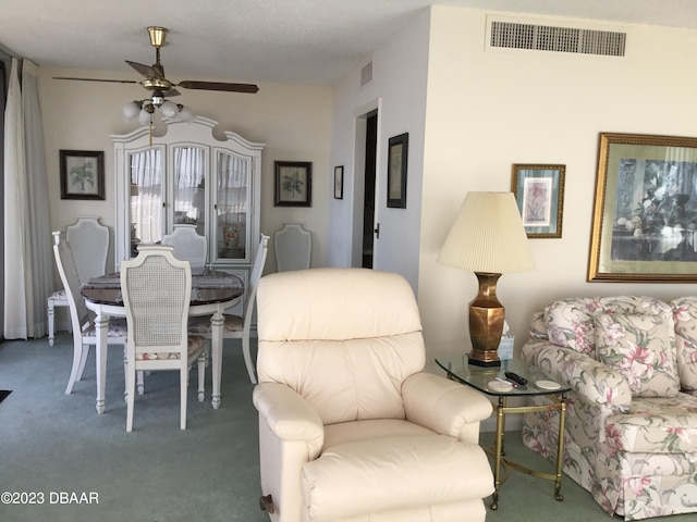 dining room featuring ceiling fan and carpet floors