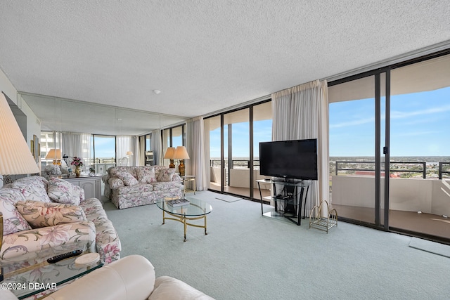 living room featuring plenty of natural light, carpet flooring, a textured ceiling, and floor to ceiling windows