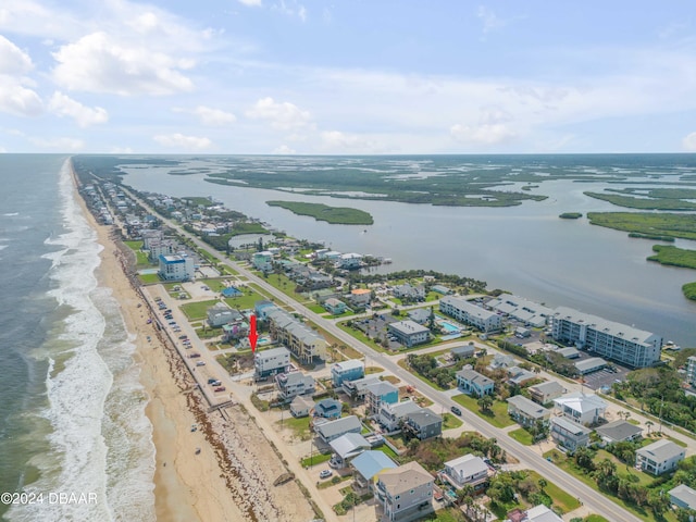 aerial view featuring a water view and a view of the beach