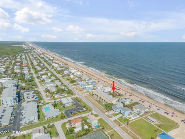 bird's eye view with a water view and a view of the beach