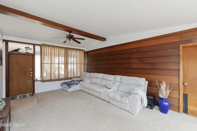 4245 Cardinal Blvd, Port Orange, FL 32127 - carpeted living area featuring vaulted ceiling with beams, a ceiling fan, and wood walls