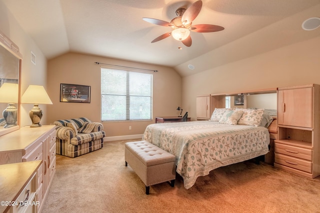 carpeted bedroom with ceiling fan and lofted ceiling