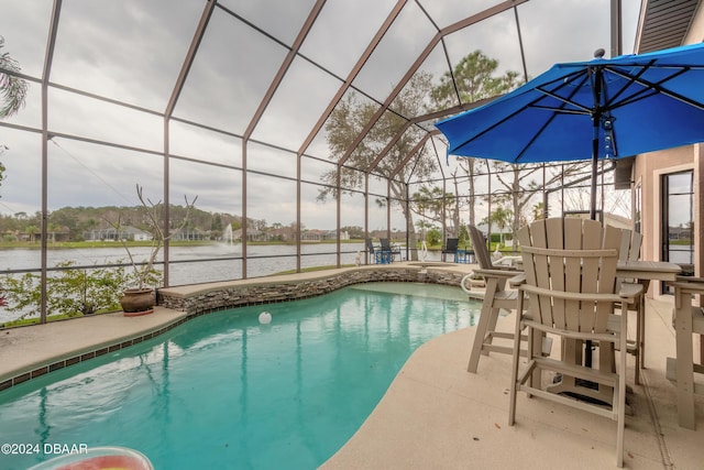 view of pool featuring a lanai, a patio area, and a water view