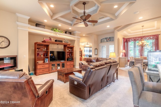 carpeted living room with ceiling fan with notable chandelier, beam ceiling, french doors, and coffered ceiling