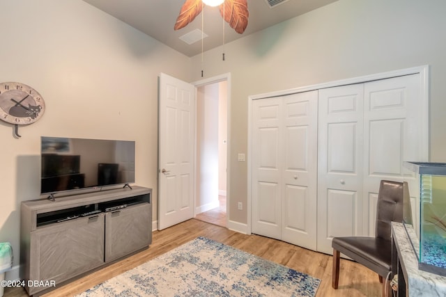 interior space with ceiling fan and light hardwood / wood-style flooring