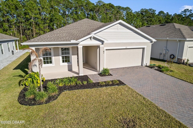 ranch-style house with stucco siding, a front lawn, decorative driveway, roof with shingles, and an attached garage