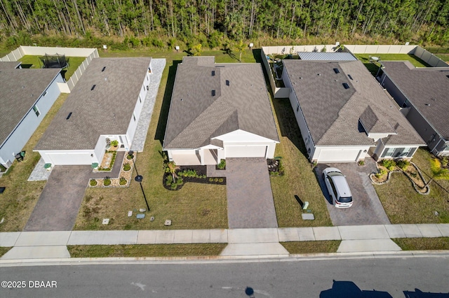 birds eye view of property with a residential view